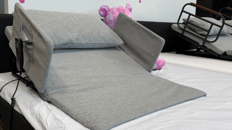 No More Struggling to Sit Up in Bed with This Portable Power Backrest With Side Rails